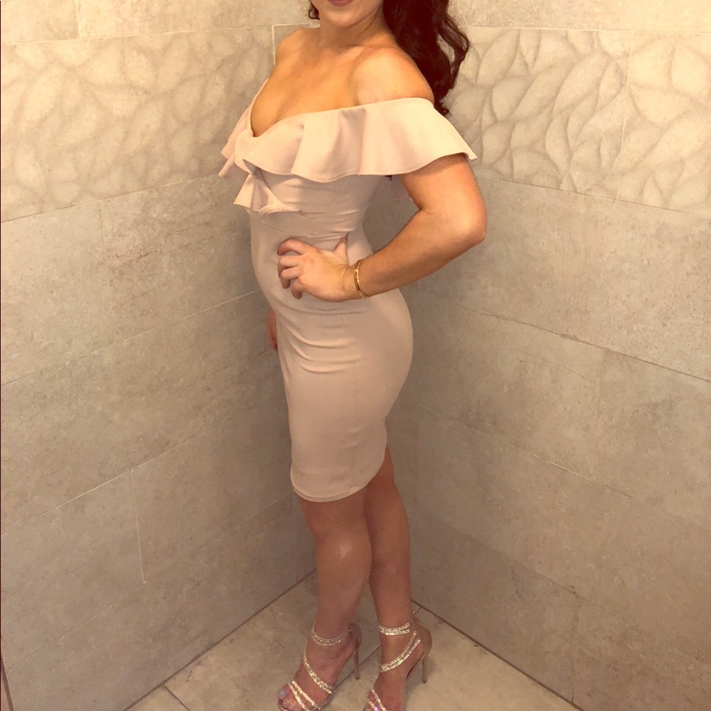 Off the shoulder knee length dress.
